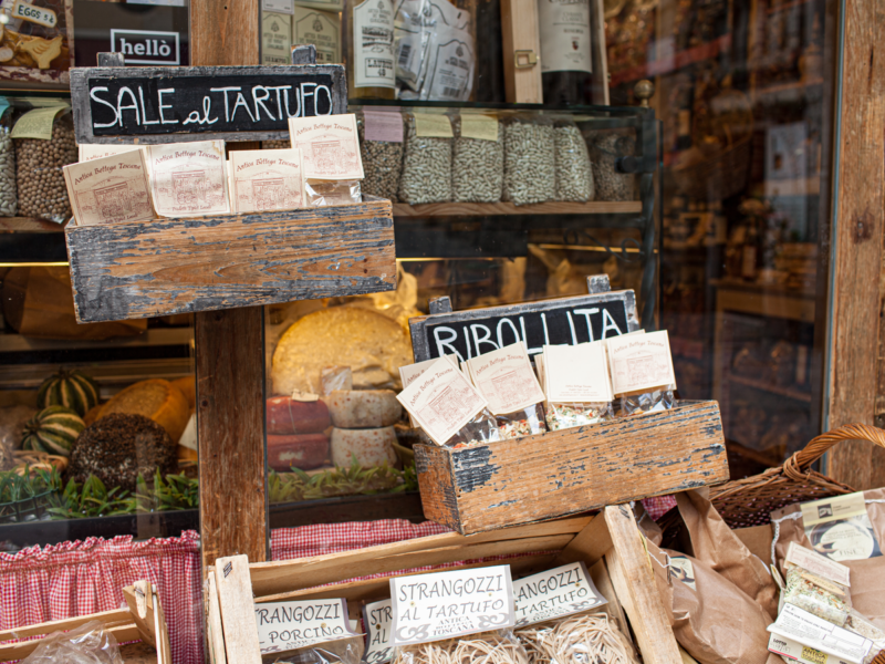 AREZZO, TUSCANY, ITALY - JANUARY 10, 2016- Typical Italian products displayed on the storefront of Antica Bottega Toscana, one of the oldest shops in Arezzo selling typical food products of Tuscany