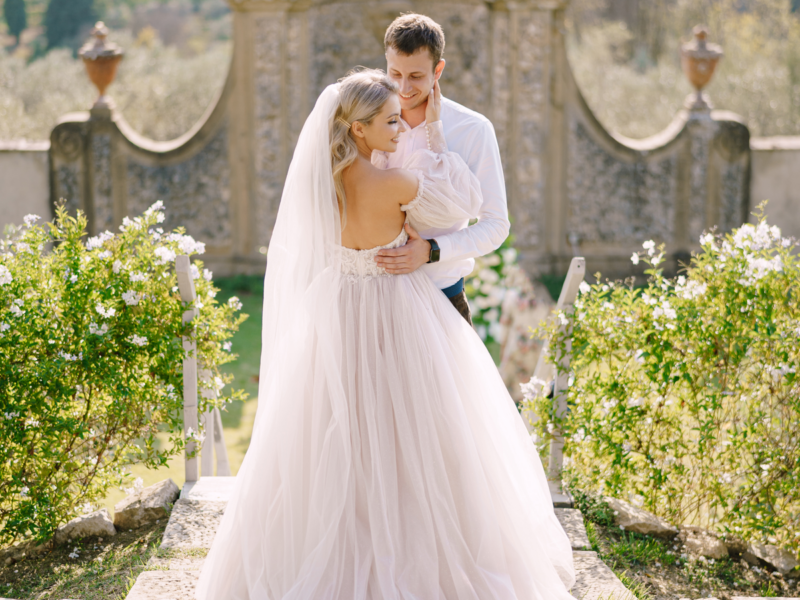 Wedding in Florence, Italy, in an old villa-winery. Wedding couple in the garden at sunset