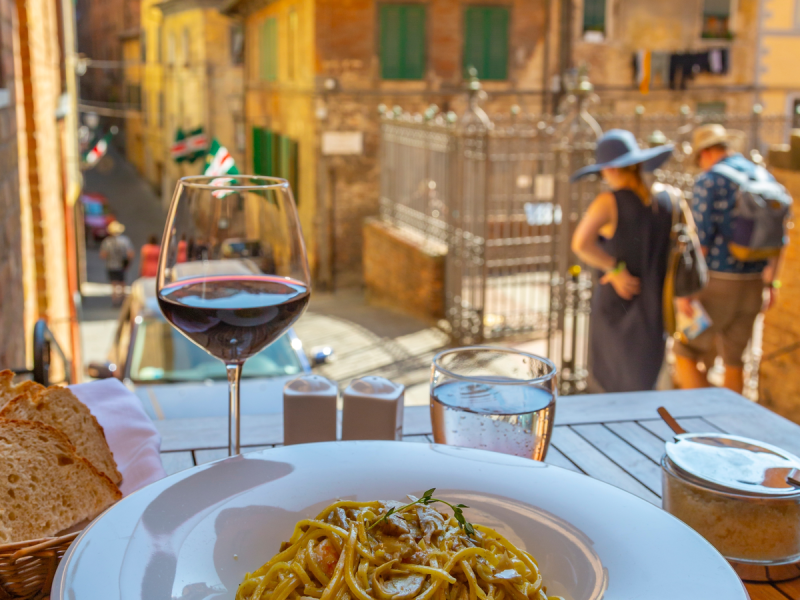 View of traditional Italian cuisine, pasta and wine, Siena, Tuscany, Italy, Europe